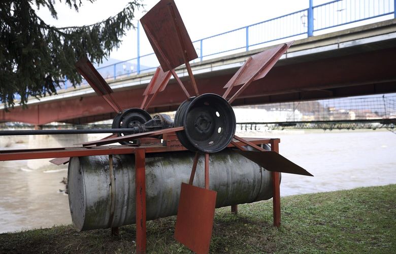 Improvised hydropower plant which now serves as a monument in seen on the bank of Drina river in Gorazde, Bosnia, Monday, Dec. 19, 2022. To survive and keep the lights on in their besieged town – cut off throughout Bosnia’s 1992-95 interethnic war from access to electricity grid, food, medicine and the outside world – the people of Gorazde had to come up with various creative inventions. (AP Photo/Armin Durgut) XAD106 XAD106