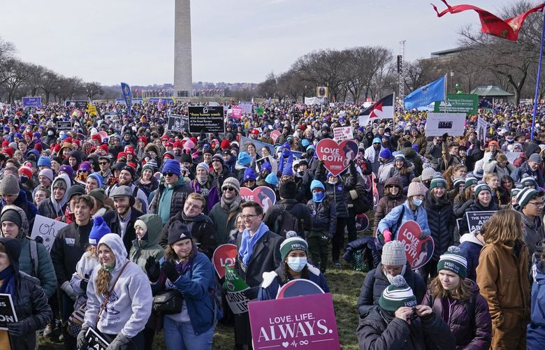 FILE – People attend the March for Life rally on the National Mall in Washington, Friday, Jan. 21, 2022. The annual March for Life will be held Friday, Jan. 20, 2023. (AP Photo/Susan Walsh, File) WX202 WX202