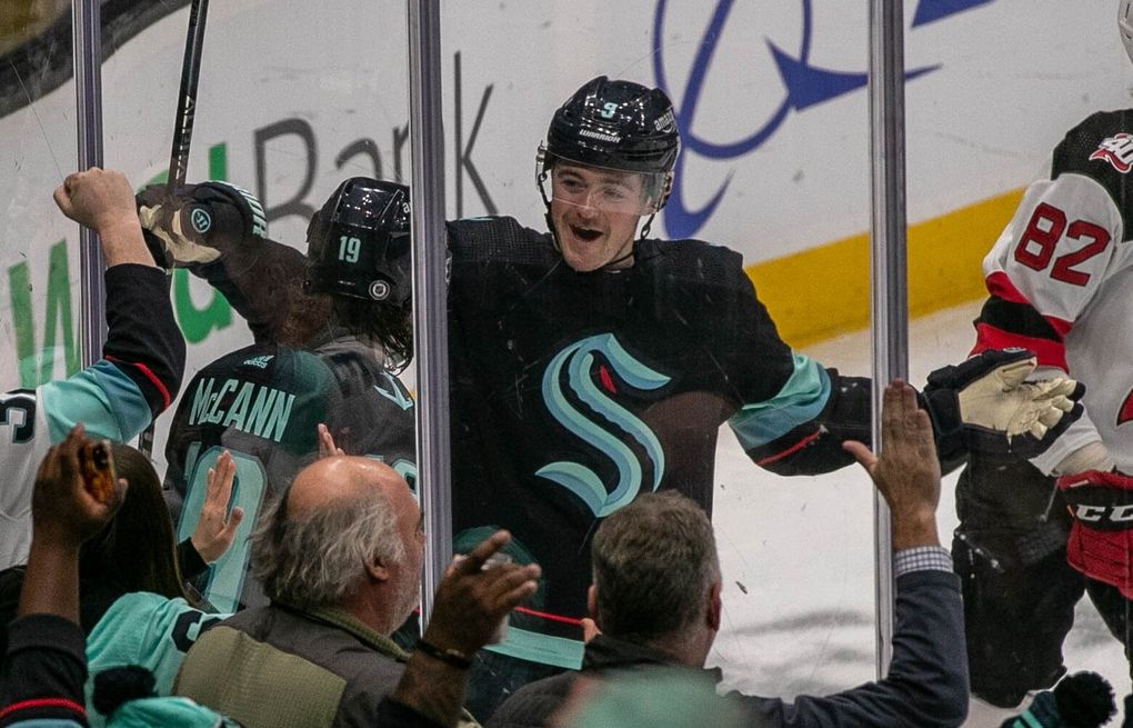 Seattle Kraken center Ryan Donato (9) swings a toy stuffed salmon after the  4-3 win over the New Jersey Devils in an NHL hockey game, Thursday, Jan.  19, 2023, in Seattle. The