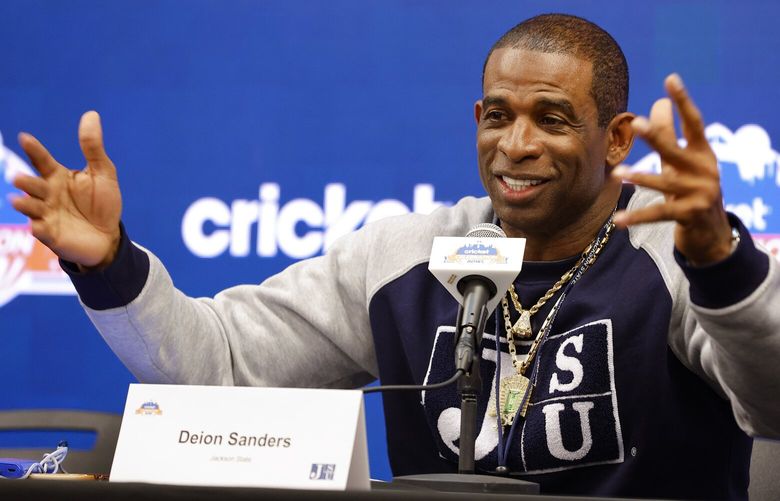 FILE -Deion Sanders speaks during a news conference for the Celebration Bowl NCAA college football game between North Carolina Central and Jackson State, Friday, Dec. 16, 2022 in Atlanta. The University of Colorado introduced a pilot program that makes the credit review for transfer students a more seamless process. It may have been the move that ultimately lured Deion “Coach Prime” Sanders to Boulder. (AP Photo/Todd Kirkland, File) NY153 NY153