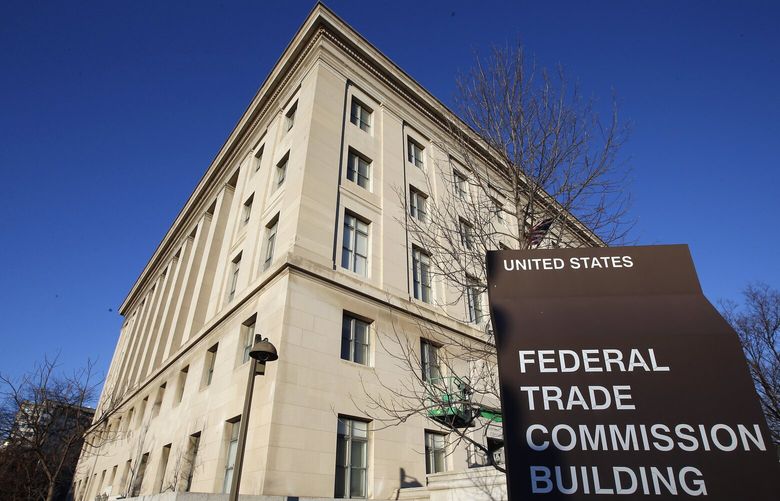FILE – The Federal Trade Commission building in Washington is pictured on Jan. 28, 2015. The Federal Trade Commission is proposing a new rule that would prevent employers from imposing noncompete clauses on their workers. (AP Photo/Alex Brandon, File) NYSS402