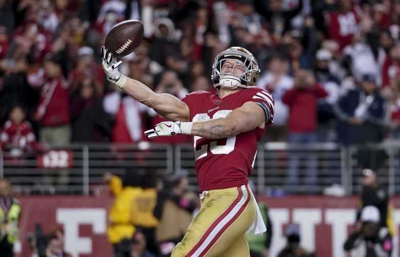 San Francisco 49ers running back Christian McCaffrey celebrates after scoring against the Dallas Cowboys during the second half of an NFL divisional playoff football game in Santa Clara, Calif., Sunday, Jan. 22, 2023. (AP Photo/Godofredo A. Vásquez) FXN154 FXN154