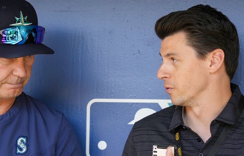 Mariners broadcaster Aaron Goldsmith interviews manager Scott Servais before a 2022 game at T-Mobile Park. (Ben Van Houten / Seattle Mariners)