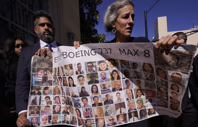 Naheed Noormohamed, left, son of Ameen Ismail Noormohamed, and Nadia Milleron, mother of Samya Stumo, carry photos photos of their family and others killed in the 2019 crash of Ethiopian Airlines 737 Max aircraft after the federal court arraignment of Boeing in Fort Worth, Texas, Thursday, Jan. 26, 2023.(AP Photo/LM Otero) TXMO108 TXMO108