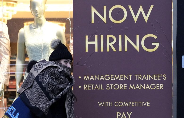 A hiring sign is displayed at a retail store in Chicago, Thursday, Jan. 5, 2023. (AP Photo/Nam Y. Huh) 