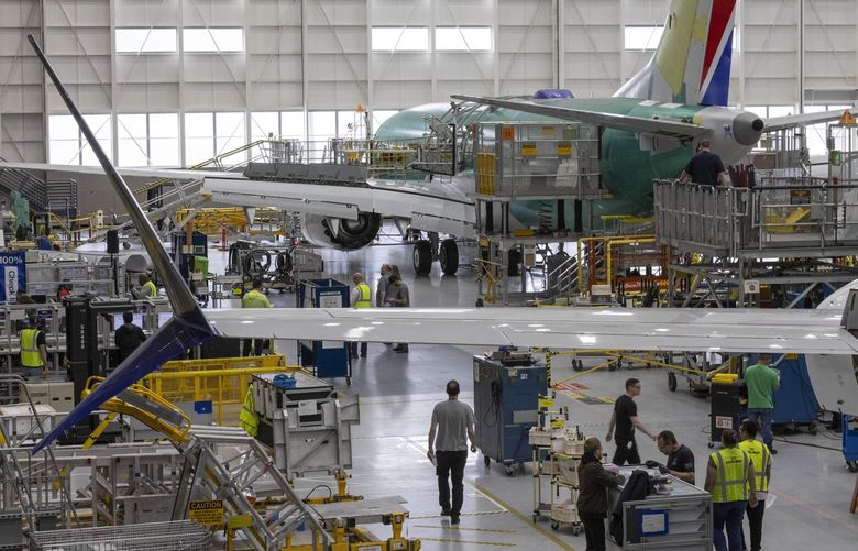 Boeing employees work on the 737 MAX on the final assembly line at Boeingâ€™s Renton plant Wednesday, June 15, 2022. 220682