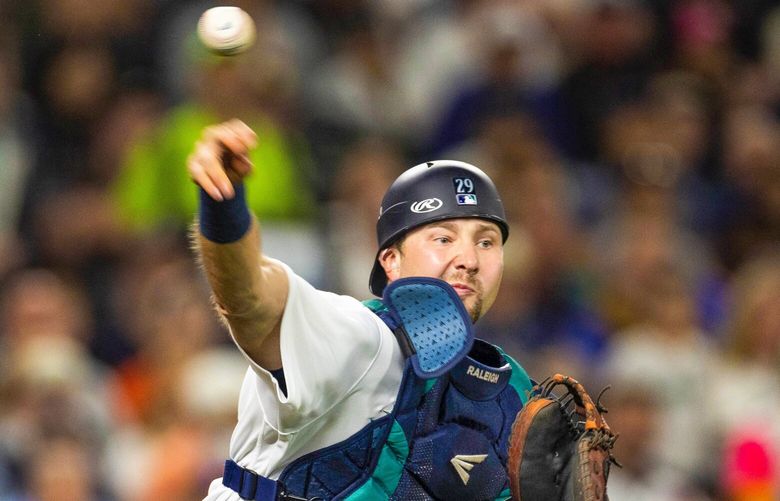 Cal Raleigh retires San Diego Padres Wil Myers at first on a drop-third strike to end the fifth inning, Sept. 13, 2022, in Seattle. 221564