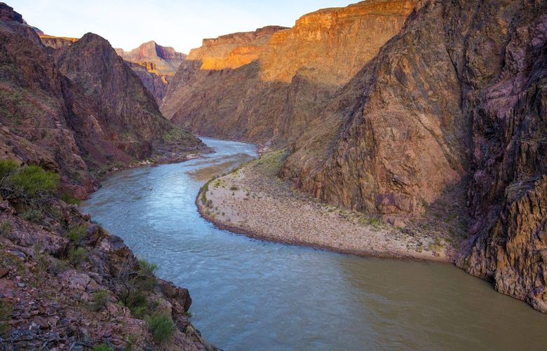 FILE — The Colorado River flows through the Grand Canyon in Arizona, March 7, 2020. Seven states that rely on the river for water were supposed to voluntarily cut back. Now, it appears the government will have to impose reductions. (John Burcham/The New York Times) XNYT1