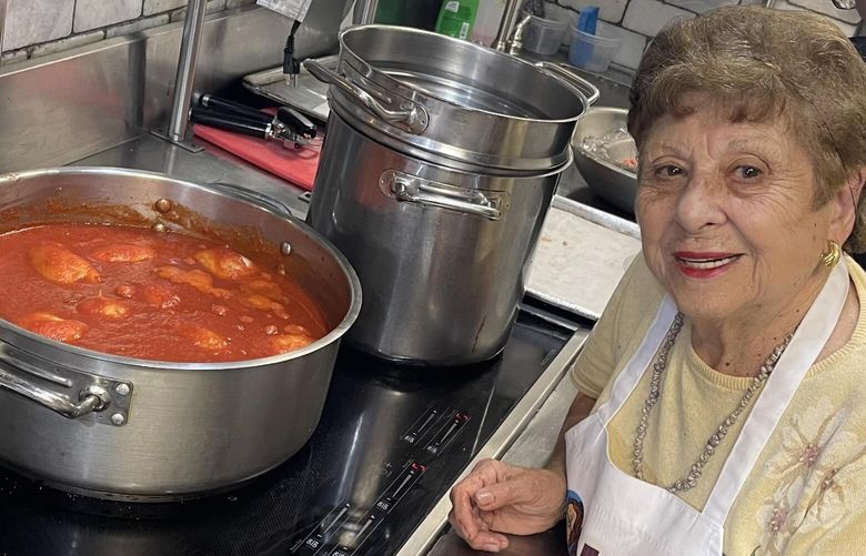Maria Gialanella, 88, prepares a fresh Italian sauce. For the past 10 years, she has been cooking at Enoteca Maria, on Staten Island, alongside matriarchs from other cultures. MUST CREDIT: Courtesy of Enoteca Maria