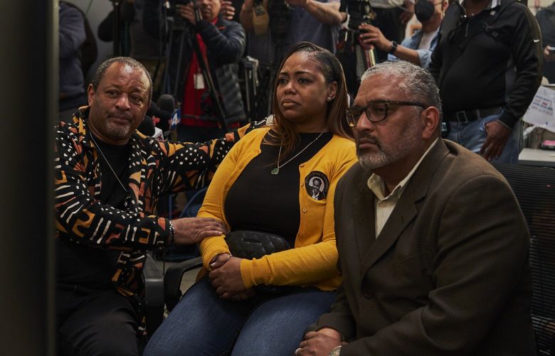 Lora King, daughter of Rodney King and Najee Ali, left, a civil rights activist, along with community members watch the video release of the beating of Tyre Nichols by five Memphis Police officers at Community Build, a non profit organization, in Los Angeles on Friday, Jan. 27, 2023. Images from Nichols’ death have drawn comparisons to shocking footage of the assault of Rodney King, a watershed episode more than three decades ago. (Philip Cheung/The New York Times) XNYT185 XNYT185