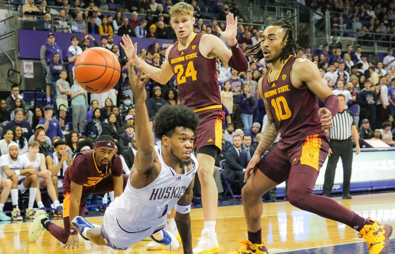Keion Brooks Jr. tries to keep the ball from going out of bounds on the Huskies in the second half. 222881