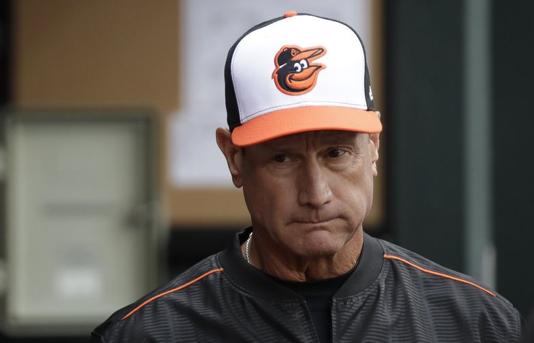 Baltimore Orioles bench coach John Russell walks in the dugout during an opening day baseball game against the Toronto Blue Jays in Baltimore, Monday, April 3, 2017. (AP Photo/Patrick Semansky)