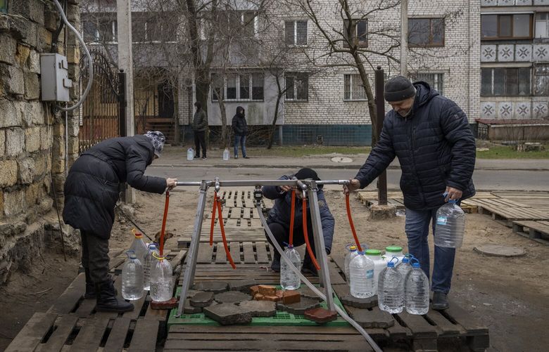 Local residents collect drinking water from a public distribution point in Mykolaiv, Ukraine on Friday, Jan. 27, 2023. Russian shelling has killed at least eight civilians in towns and villages along the front line in Donetsk Province in eastern Ukraine over the past 24 hours, local officials said on Friday, the latest violence in a region that has experienced the warâ€™s heaviest recent fighting and that Ukraine fears could be a target of a fresh offensive by Moscow. (Ivor Prickett/The New York Times) XNYT48 XNYT48
