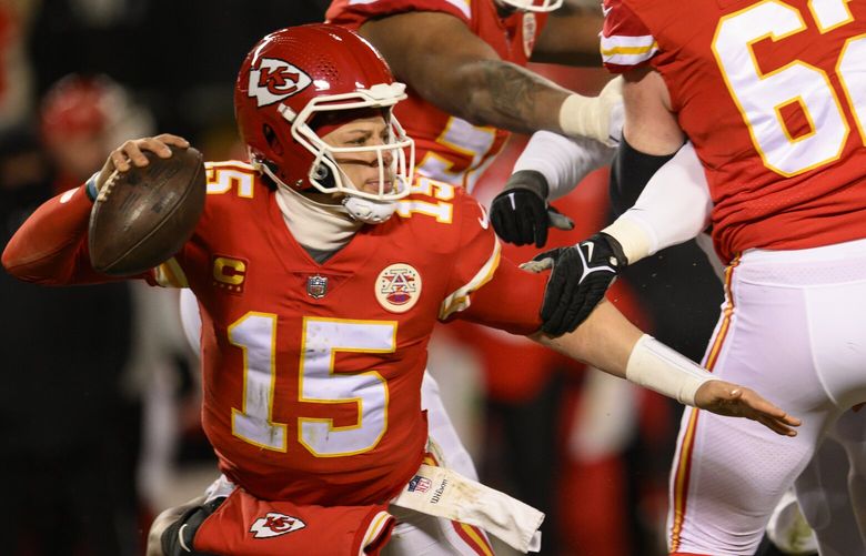 Kansas City Chiefs quarterback Patrick Mahomes (15) tries to escape pressure from the Cincinnati Bengals during during the second half of the NFL AFC Championship playoff football game, Sunday, Jan. 29, 2023 in Kansas City, Mo. (AP Photo/Reed Hoffmann) NYOTK NYOTK