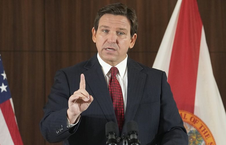 FILE – Florida Gov. Ron DeSantis gestures during a news conference, Thursday, Jan. 26, 2023, in Miami. DeSantis on Tuesday, Jan. 31, 2023, announced plans to block state colleges from having programs on diversity, equity and inclusion, and critical race theory. (AP Photo/Marta Lavandier, File) NYSS201 NYSS201