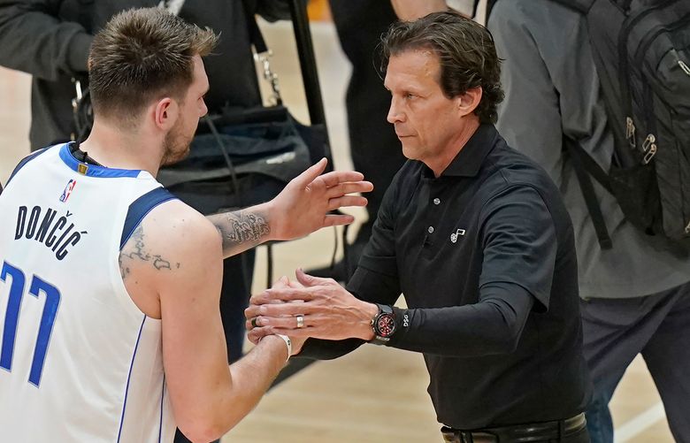 Utah Jazz head coach Quin Snyder, right, greets Dallas Mavericks’ Luka Doncic (77)  in Game 6 of an NBA basketball first-round playoff series, April 28, 2022, in Salt Lake City. Snyder was the director of a Basketball Africa League Combine in Paris this week. It was his first on-court job since stepping down as Jazz coach last spring (AP Photo/Rick Bowmer, file)