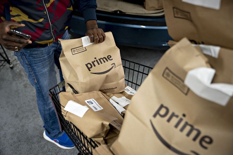 to start charging Prime members for grocery orders under $150