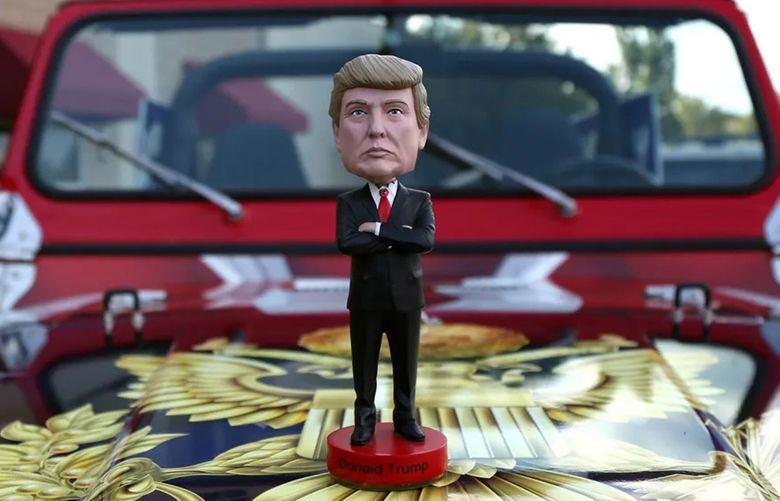 FILE — A Donald Trump bobblehead hood ornament outside a debate watch party in Topeka, Kan. on Aug. 7, 2018. Truth Social, the social network started by former President Donald Trump, has struggled to attract large brands, though bobbleheads are advertised. (Christopher Smith/The New York Times)