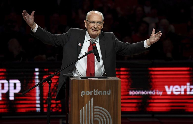 FILE – Former radio announcer for the Portland Trail Blazers Bill Schonely reacts to the fans as he is honored during halftime of an NBA basketball game against the Utah Jazz in Portland, Ore., Sunday, April 10, 2022. Bill Schonely, the longtime Portland Trail Blazers broadcaster who coined the phrase “Rip City” died on Saturday, Jan. 21, 2023. He was 93. (AP Photo/Steve Dykes) NYMV501 NYMV501