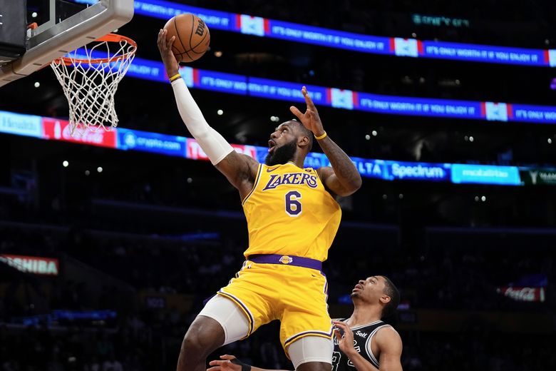 James scores 33 points, Lakers win a close one without Davis