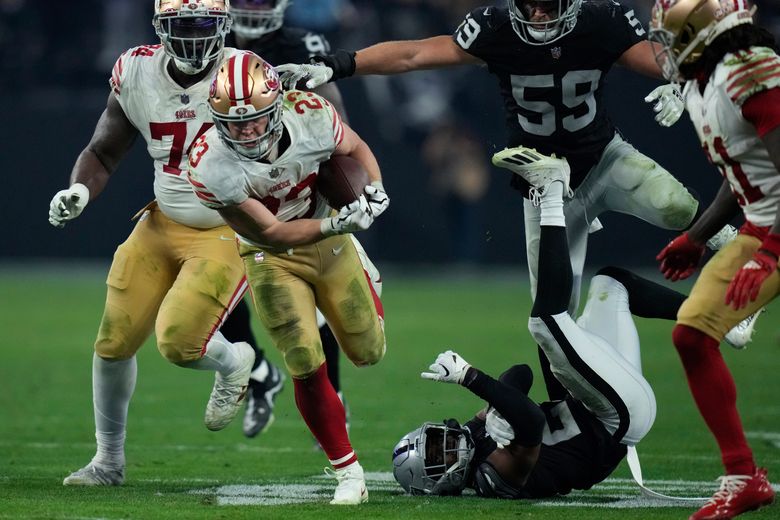 Christian McCaffrey of the San Francisco 49ers rushes the ball in