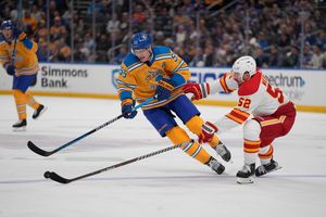 Thomas scores in OT, Blues rally past Flames 4-3 - Seattle Sports