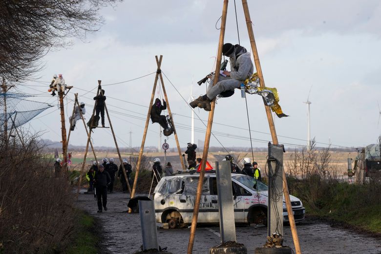 German police conduct raids on climate activists as impatience mounts