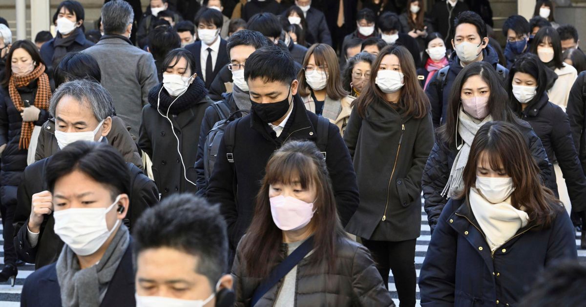 Japan to lower COVID-19 to flu status, further easing rules