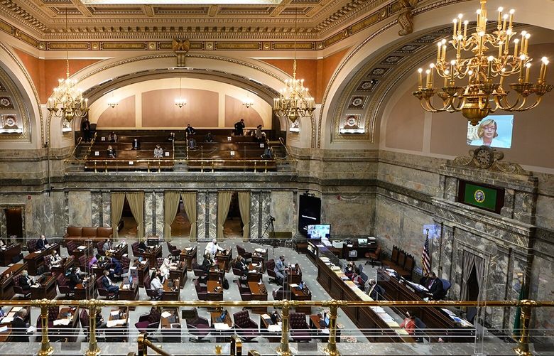 Lawmakers meet on the Senate floor, Thursday, March 10, 2022, at the Capitol in Olympia, Wash. Washington lawmakers were wrapping up their work Thursday with final votes on a supplemental state budget and a transportation revenue package before planning to adjourn the legislative session. (AP Photo/Ted S. Warren) WATW111 WATW111