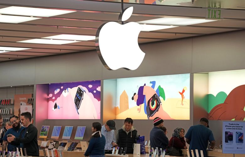 Customers shop in an Apple store in Pittsburgh Jan. 30, 2023. (AP Photo/Gene J. Puskar, File)