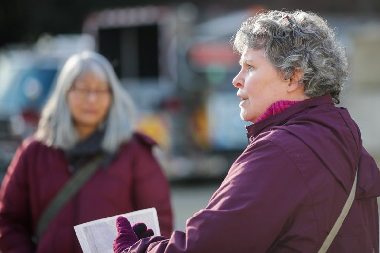 At a PFAS groundwater contamination site at Eastside Fire and Rescue, Priscilla Tomlinson, a senior toxicologist with the state Ecology Department, explains a monitoring system that&#8217;s part of an experiment to curb groundwater pollution using carbon filters. (Kevin Clark / The Seattle Times)