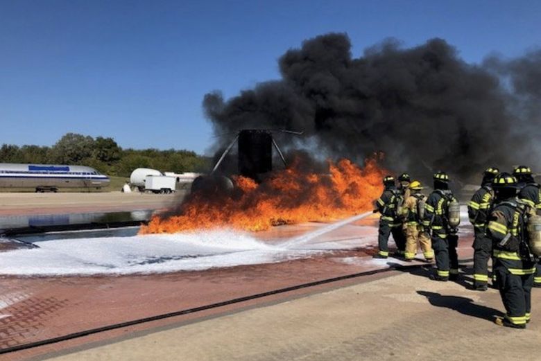 In this 2019 training exercise at Dallas Fort Worth International Airport, Sea-Tac firefighters use PFAS-free foam to douse flames. Sea-Tac plans to use only these foams in the future, and dispose of those that contain PFAS. (Courtesy of the Port of Seattle Fire Department)