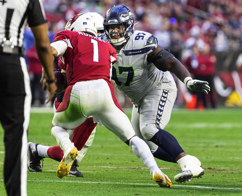 Seattle Seahawks defensive tackle Al Woods (99) reacts after a