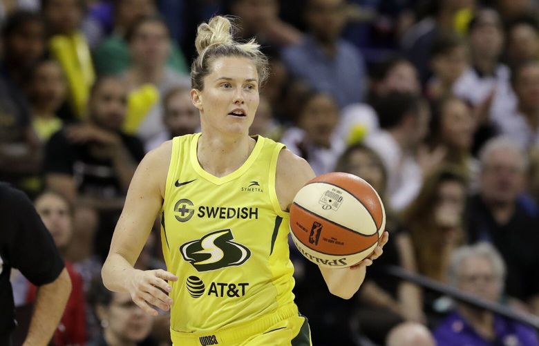Seattle Storm’s Sami Whitcomb dribbles against the Las Vegas Aces in the first half of a WNBA basketball game Friday, July 19, 2019, in Seattle. (AP Photo/Elaine Thompson)