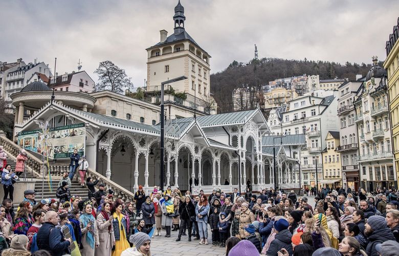Refugees from Ukraine sing folk songs at a rally in Karlovy Vary, Czech Republic, Jan. 7, 2023. Since Peter the Great visited Karlovy Vary in the 18th century, Russians have flocked to the town’s healing waters, but the Czech government, outraged by the war in Ukraine, has barred them from visiting the country as tourists, and the town must reinvent itself. (Akos Stiller/The New York Times) XNYT60 XNYT60