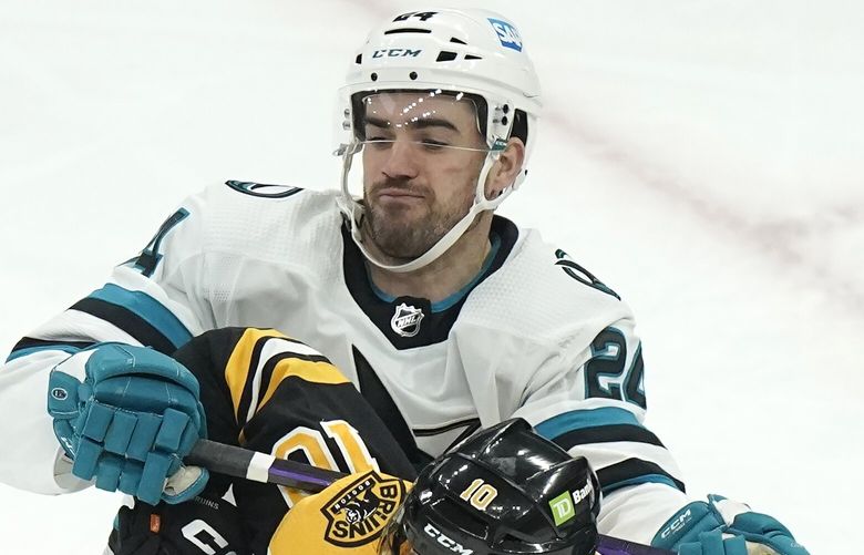 San Jose Sharks defenseman Jaycob Megna (24) collides with Boston Bruins left wing A.J. Greer (10) in the first period of an NHL hockey game, Sunday, Jan. 22, 2023, in Boston. (AP Photo/Steven Senne) MASR113 MASR113