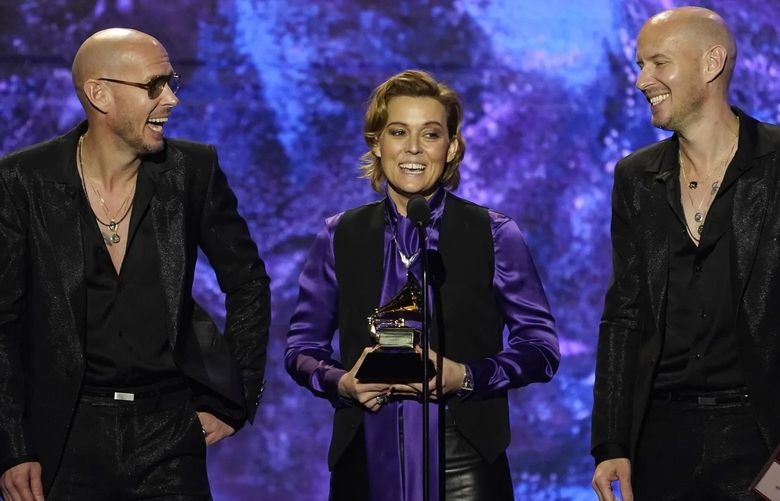 Phil Hanseroth, from left, Brandi Carlile and Tim Hanseroth accept the award for best rock song for “Broken Horses” at the 65th annual Grammy Awards on Sunday in Los Angeles. (Chris Pizzello / The Associated Press)