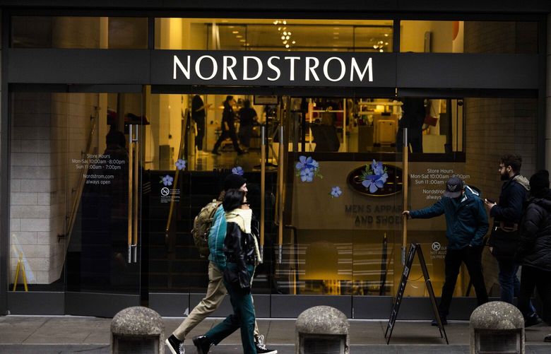 Pedestrians pass the Nordstrom flagship store Monday in Seattle. Ryan Cohen, chairman of GameStop and co-founder of online pet product retailer Chewy, has taken a stake in the Seattle-based retailer. (Daniel Kim / The Seattle Times)