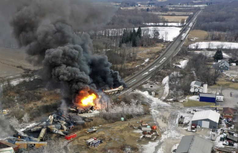 This photo taken with a drone shows portions of a Norfolk and Southern freight train that derailed Friday night in East Palestine, Ohio are still on fire at mid-day Saturday, Feb. 4, 2023. (AP Photo/Gene J. Puskar) OHGP106 OHGP106