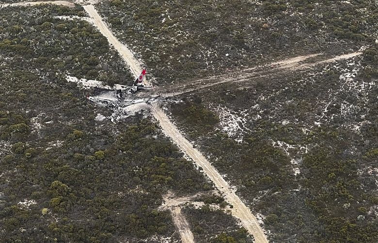 This image supplied by the Department of Fire and Emergency Services of Western Australia, shows the wreckage of a Boeing 737-3 with two people on board that went down over the Fitzgerald River National Park in Western Australia, Monday, Feb 6, 2023. The water bomber crashed in the forest between Ravensthorpe and Hopetoun. (DFES via AP) XWA802 XWA802