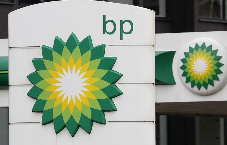 The logo of British Petroleum, BP, adorns a petrol station in west London, Tuesday, Aug. 4, 2020.  (AP Photo/Alastair Grant)
