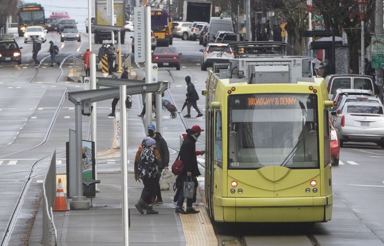 Passengers board a streetcar at 5th Ave. S.  and  S. Jackson St. in Seattle Tuesday, February 7, 2023.  

A federal audit complains about $3.8 million the USDOT gave Seattle to build a downtown streetcar, that’s been suspended for years.  222989 (Ellen M. Banner / The Seattle Times)