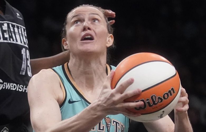 New York Liberty guard Sami Whitcomb (32) goes to the basket against Seattle Storm center Ezi Magbegor (13) during the second half of a WNBA basketball game, Sunday, June 19, 2022, in New York. (AP Photo/Mary Altaffer)
