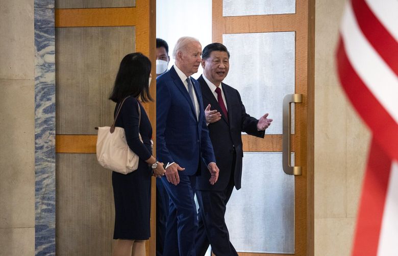FILE — President Joe Biden, center, meets with President Xi Jinping of China in Bali, Indonesia, on Nov. 14, 2022. A big white orb has pushed the rival superpowers back to diplomatic distance, showing that peace may be frighteningly fragile. (Doug Mills/The New York Times) XNYT144 XNYT144