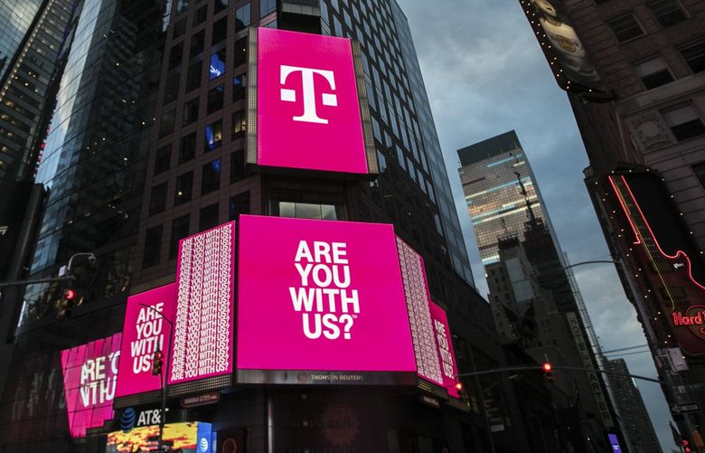 FILE — A T-Mobile sign at Time Square in New York, April 28, 2018. The merger between Sprint and T-Mobile has faced harsher scrutiny in recent weeks, as Democratic lawmakers, empowered by their House majority, have amplified their criticism of the deal. (Jeenah Moon/The New York Times)