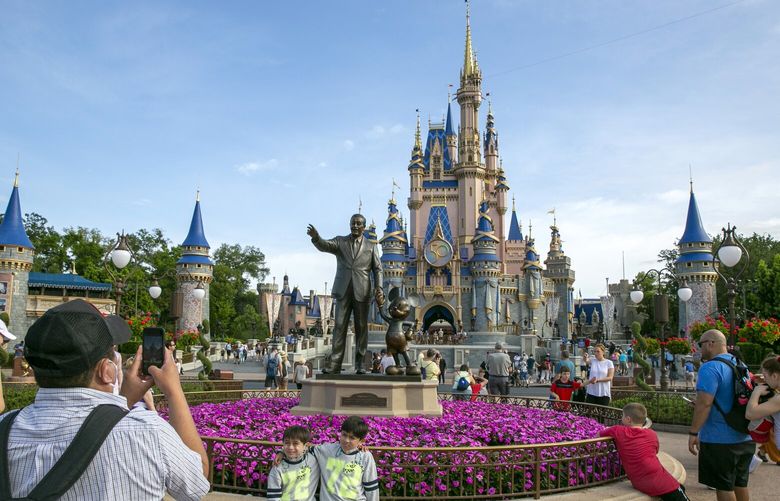 FILE – People visit Magic Kingdom Park at Walt Disney World Resort in Lake Buena Vista, Florida, on April 18, 2022. (AP Photo/Ted Shaffrey, File) 