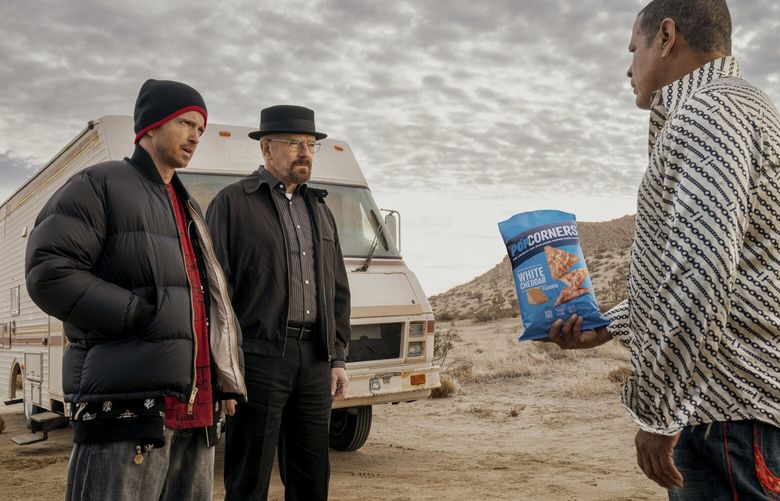 This photo provided by Frito-Lay shows Aaron Paul, Bryan Cranston and Raymond Cruz in scene from PopCorners 2023 Super Bowl NFL football spot. (Frito-Lay via AP) NYSUP112 NYSUP112