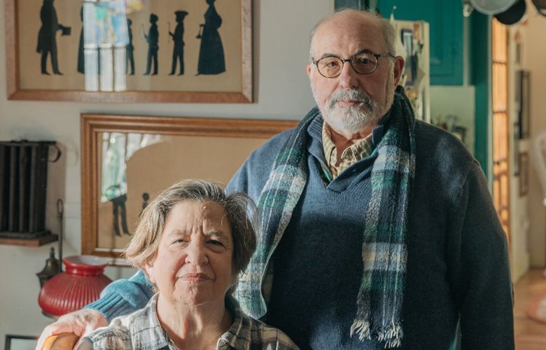Sharon Cohen and her husband Jean-Henry Mathurin at their home in Newtown, Conn.,  Jan. 21, 2023. As costs rise, many older Americans have changed the way they shop and eat out, and for some, it could affect their health or leave them feeling isolated. (Jeenah Moon/The New York Times)