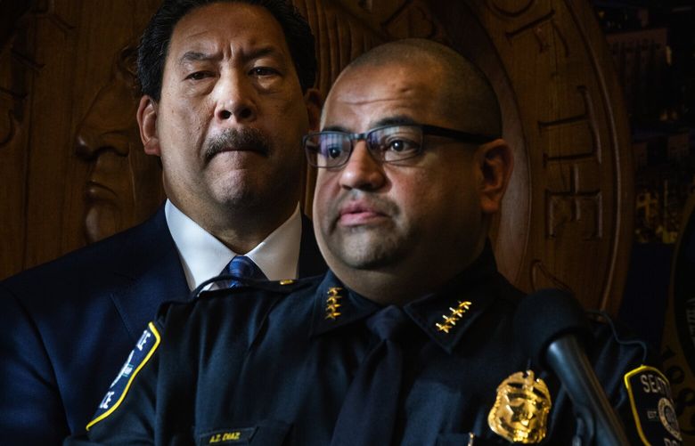 Mayor Bruce Harrell, left, and Seattle Police Department Chief Adrian Diaz take questions from reporters during a news conference about the fatal shooting at Ingraham High School, Tuesday, Nov. 8, 2022, in Seattle.