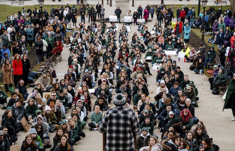 Michigan State University students participate in a sit-in demonstration at the State Capitol, while Rep. Elissa Slotkin (D-Mich.) delivers remarks following a mass shooting at the school, in East Lansing on Wednesday, Feb. 15, 2023. A gunman killed three people and wounded five others, all students, at Michigan State University on Monday, setting off a three-hour police manhunt and forcing students to hide in their dormitories at one of America’s largest university campuses. (Nick Hagen/The New York Times) XNYT175 XNYT175